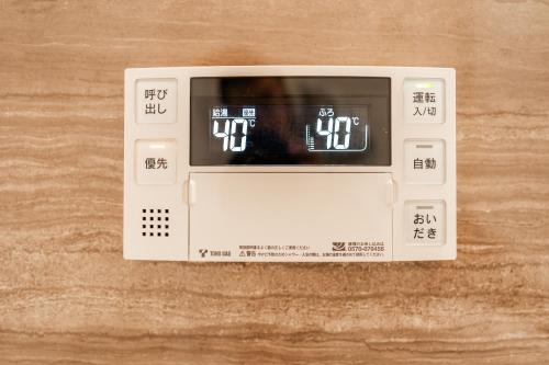 a toaster oven sitting on top of a table at X101Near Nagoya Station detached hous 12 people in Nagoya