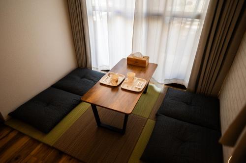 a small room with a table and two chairs at X101Near Nagoya Station detached hous 12 people in Nagoya