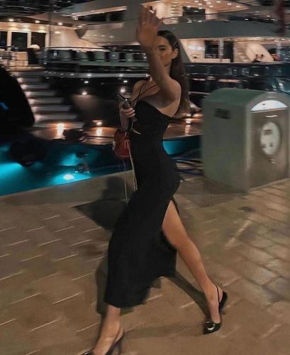 a woman in a black dress is dancing at Pyra Hospitality West Pyramids Cairo in Cairo
