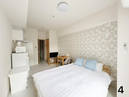 Η κουζίνα ή μικρή κουζίνα στο Nishinakajima Apartment