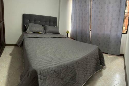 Postel nebo postele na pokoji v ubytování Apartamento en Bello Medellín