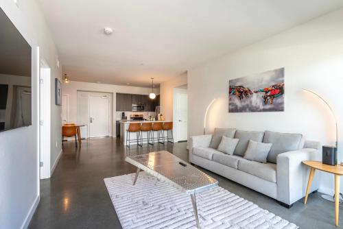 a living room with a couch and a table at Brand New 2BR Luxury Apartment WeHo in Los Angeles