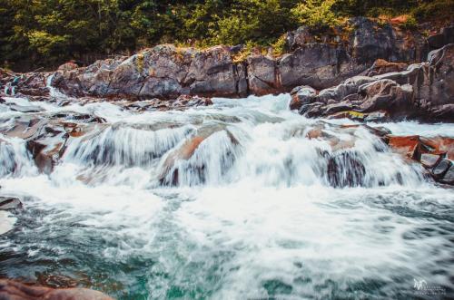 a stream of water rushing over rocks in a river at Golden Palace in Dubove