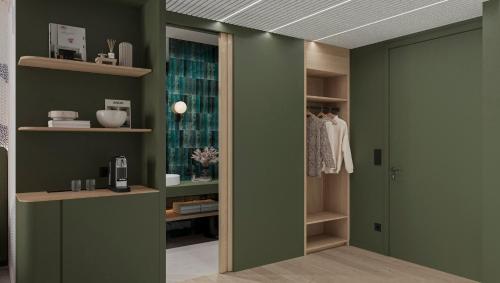 a room with green walls and a door with shelves at voco Brussels City North by IHG in Vilvoorde
