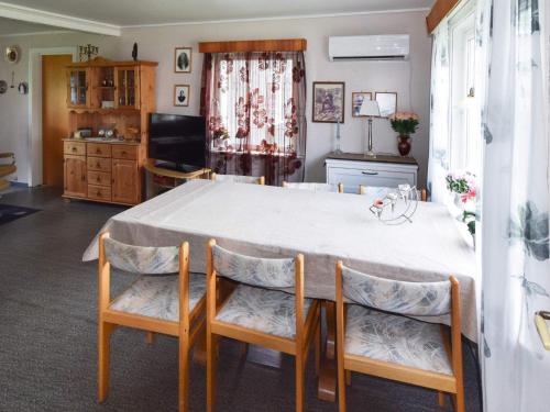 a kitchen with a white table and chairs at 8 person holiday home in Terr k in Terråk