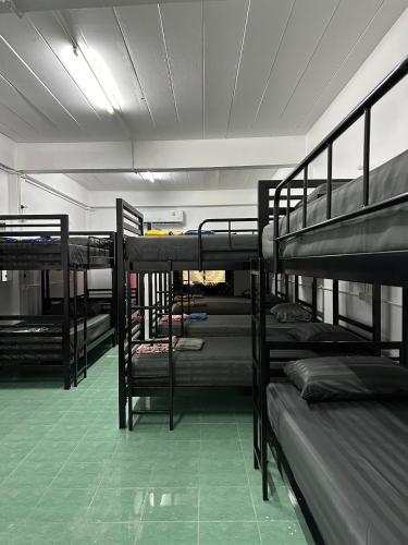 a group of bunk beds in a room at Moon Dance Hostel in Haad Rin