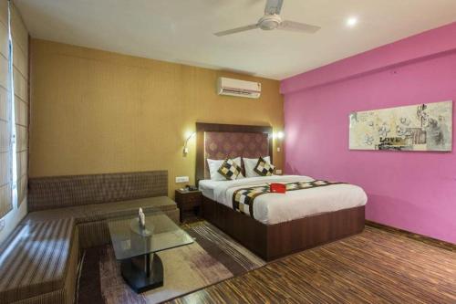 Ένα ή περισσότερα κρεβάτια σε δωμάτιο στο Hotel Meenakshi Palace