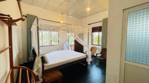 Postel nebo postele na pokoji v ubytování Villa Don Williams Weligama