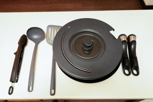 a plate with a camera on a table with utensils at N262walk 3 minutes to Osu shopping street stay 8 people in Aoichō