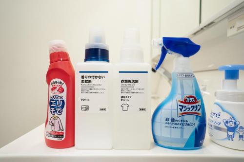 three bottles of disinfectants and a bottle of cleaner on a counter at N262walk 3 minutes to Osu shopping street stay 8 people in Aoichō