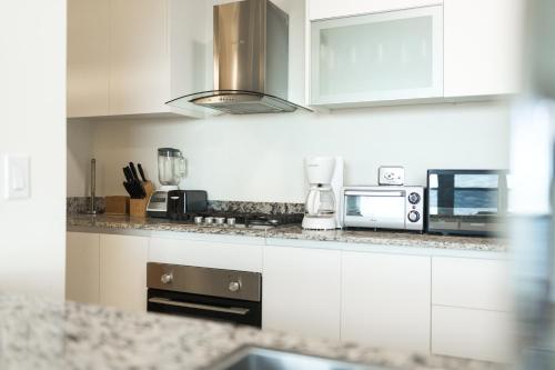 Η κουζίνα ή μικρή κουζίνα στο Ventanas del Mar by Playa Caracol Residences