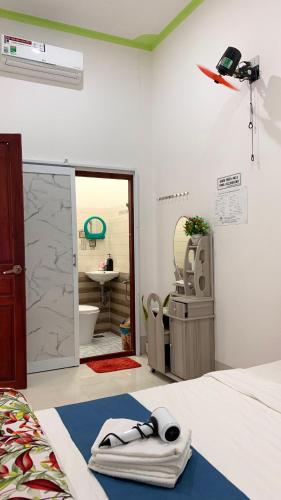 Postel nebo postele na pokoji v ubytování Homestay Châu Triều - Phan Thiết