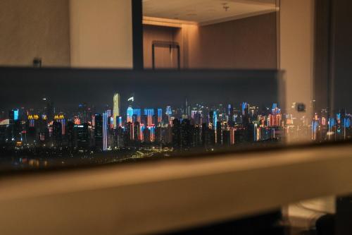 a view of a city skyline at night at Wuhan Marriott Hotel Wuchang in Wuhan