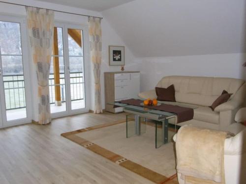 a living room with a couch and a table at Holiday apartment summer Wachau 2 in Spitz
