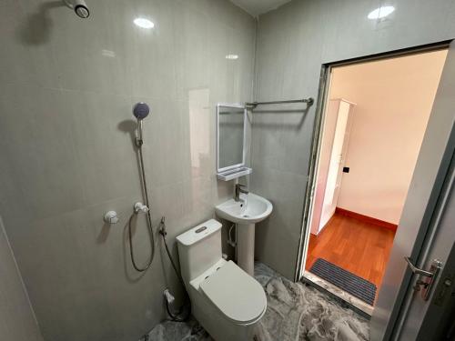 a bathroom with a toilet and a sink at Villa Oneocean in Kondey