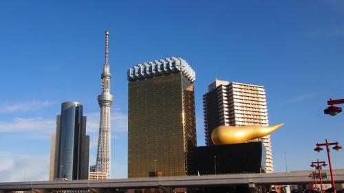 a view of a city with a building and a tower at Toyoko Inn Kanda Akihabara in Tokyo