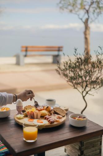 a plate of food on a table with a plate of food at Hotel Kyani Akti in Xylokastron
