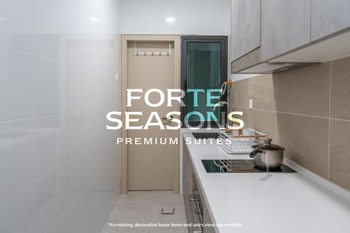 a kitchen with the words forite seasons written on it at Enclave Nature Suites @ Bukit Tinggi in Bentong
