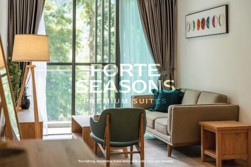 a living room with a couch and a table at Enclave Nature Suites @ Bukit Tinggi in Bentong