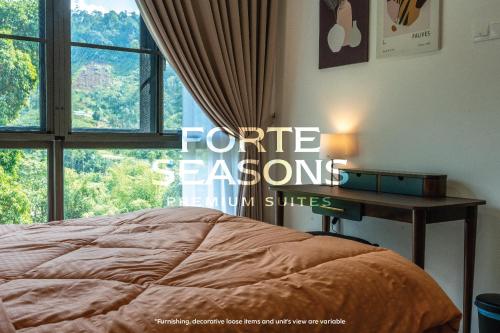 a bedroom with a bed and a desk with a window at Enclave Nature Suites @ Bukit Tinggi in Bentong