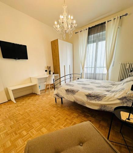 En eller flere senge i et værelse på D-Living Casa Vigevano