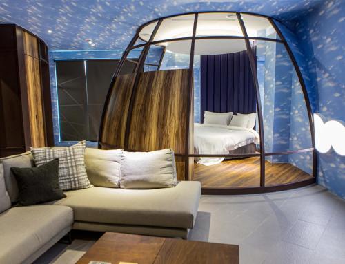 Postel nebo postele na pokoji v ubytování All-Ur Boutique Motel - Tai Tung Branch