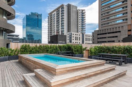 a swimming pool on top of a building at One Thibault Apartments by ITC Hospitality in Cape Town