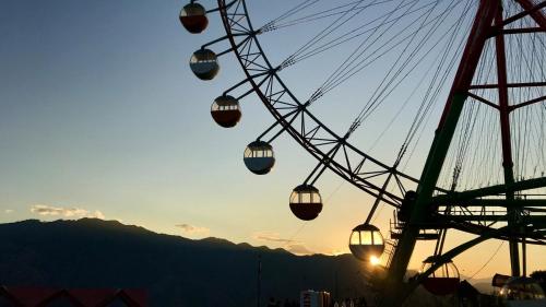 a ferris wheel at a carnival at sunset at Toyoko Inn Keio sen Hashimoto eki Kita guchi in Sagamihara