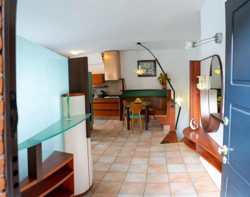 a kitchen and a dining room with a table at K's House in Lecco