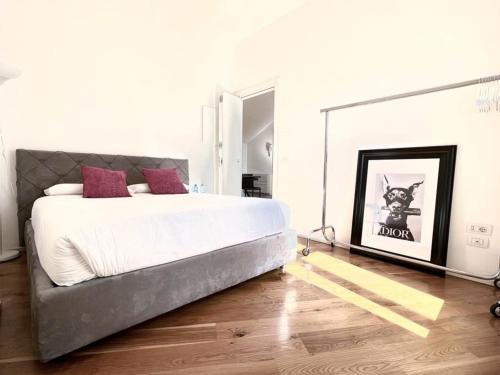 En eller flere senge i et værelse på ComeCasa Attic 3 min walk from Duomo