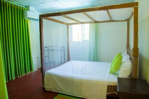 Säng eller sängar i ett rum på Green View Lodge
