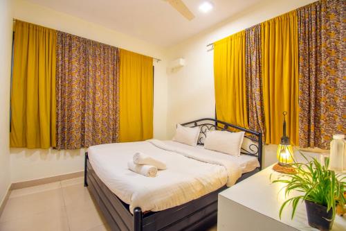 Una cama o camas en una habitación de Flora Ecostay Resort and Spa Lonavala