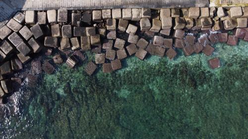 an aerial view of a stone wall in the water at Loft 900 - Home & SPA - A Timeless Luxury in Monopoli in Monopoli