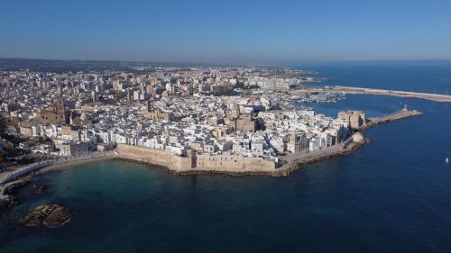 an aerial view of a city on the water at Loft 900 - Home & SPA - A Timeless Luxury in Monopoli in Monopoli