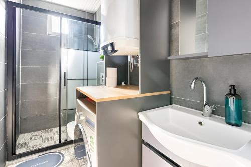 a small bathroom with a sink and a shower at Villa Blue House Garden Hot Tub Konyaalti Antalya in Antalya