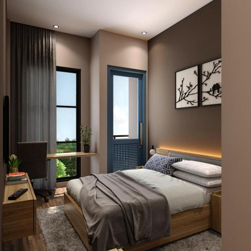 - une chambre avec un lit et 2 fenêtres dans l'établissement Sajiwa Inn and Suite Hotel, à Jepara