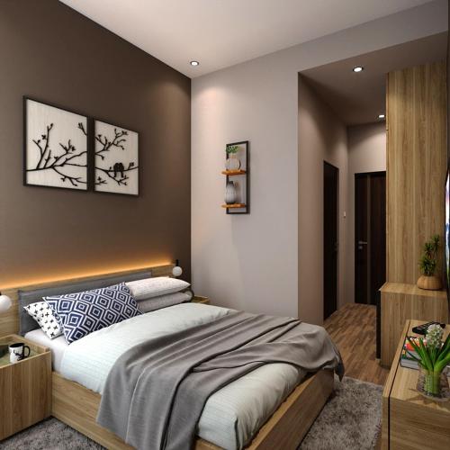 - une chambre avec un grand lit dans l'établissement Sajiwa Inn and Suite Hotel, à Jepara