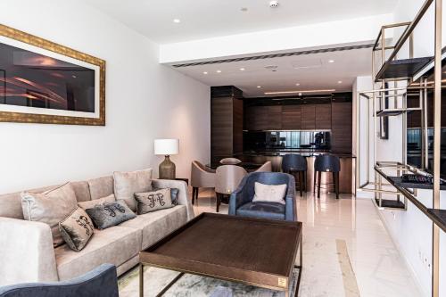 a living room with a couch and a table at Del Mar Beachfront 'C' 2 Bedroom Residence in Limassol
