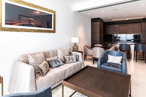 a living room with a couch and chairs at Del Mar Beachfront 'C' 2 Bedroom Residence in Limassol