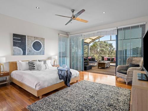 a bedroom with a bed and a living room at Diamond View in Sorrento