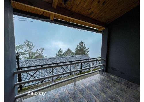 a view from the balcony of a house at Stoneshed Resort And Hotel in Nainital