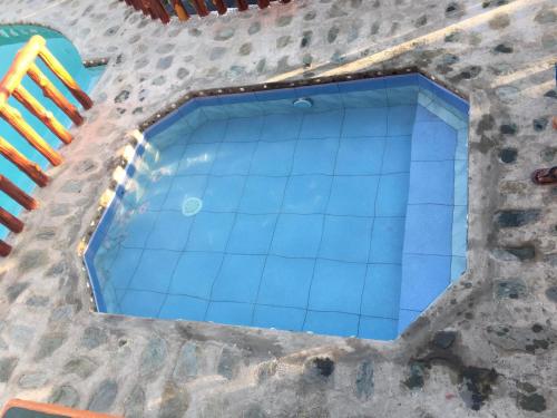 an overhead view of a swimming pool at Seashore Garden Resort in Moalboal