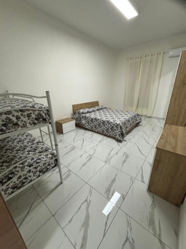 Ένα ή περισσότερα κρεβάτια σε δωμάτιο στο Binario104