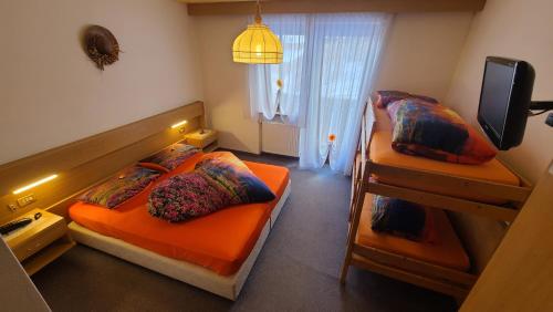 Postel nebo postele na pokoji v ubytování Hotel Garni Ongaro