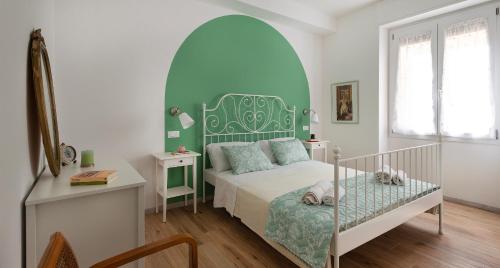 Postel nebo postele na pokoji v ubytování Ombra i Sol apartments