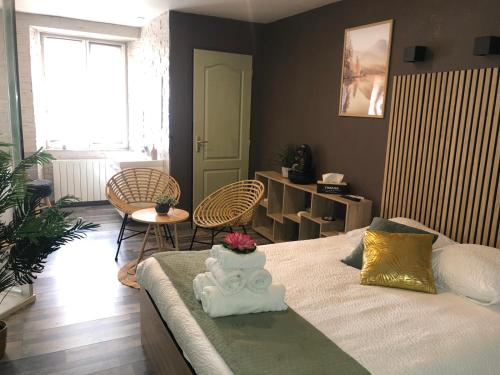 a bedroom with a bed with a cake on it at Appartement Romantique in Masevaux