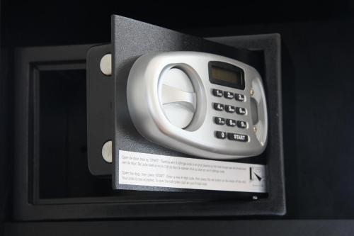 a cell phone in a black box with asensitive at Bastion Hotel Amsterdam Airport in Hoofddorp