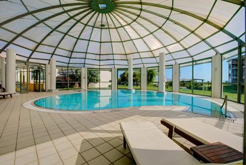 a large swimming pool with a domed roof at TUI Magic Life Candia Maris - Adults Only in Amoudara Herakliou