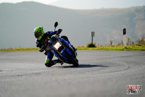 a person riding a motorcycle on a race track at Hotel Garni Ongaro in Selva di Cadore
