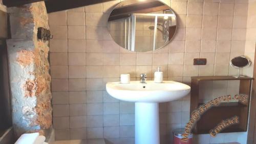 a bathroom with a sink and a mirror at Holiday house Sicily in Borgetto
